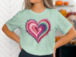 Mint t-shirt with colorful abstract heart design and gold accents.