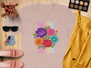 Pink t-shirt with a colorful floral bouquet and pastel stripes graphic.