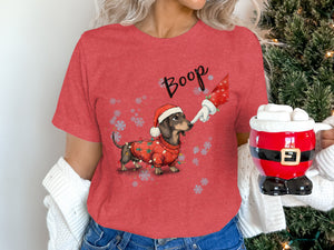 Dachshund wearing Christmas sweater and hat, with "Boop" text and Santa mug.