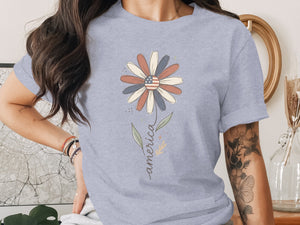 Light blue t-shirt with American flag flower design and "america" text.