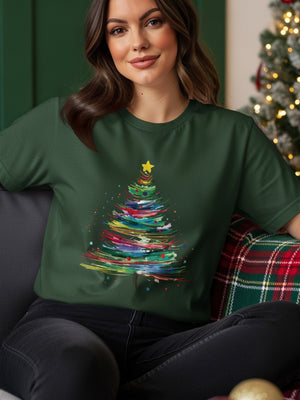 Dark green t-shirt with a colorful abstract Christmas tree graphic and a yellow star.