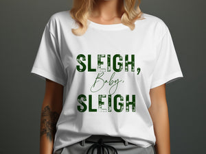 White t-shirt with green text reading "SLEIGH, Baby, SLEIGH".