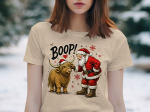 Santa booping a Highland cow with "BOOP!" text above.