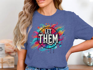 Blue t-shirt with colorful abstract design saying "LET THEM".