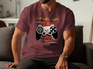 Maroon t-shirt with "LEVEL UP! NEVER QUIT PRESS START" and a retro video game controller graphic.