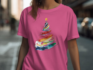 Pink t-shirt with a colorful abstract Christmas tree graphic and a yellow star.