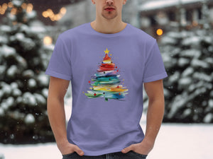 T-shirt with watercolor Christmas tree print featuring rainbow colors.