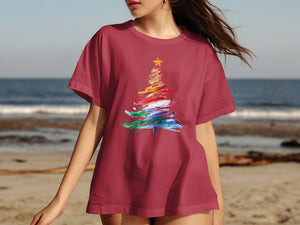 Maroon t-shirt with abstract colorful Christmas tree graphic and yellow star.