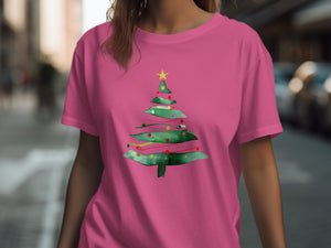 Pink t-shirt with watercolor Christmas tree graphic and yellow star.