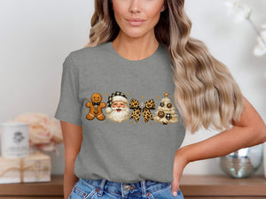 Gingerbread man, Santa, leopard bow, and Christmas tree graphic on a grey t-shirt.