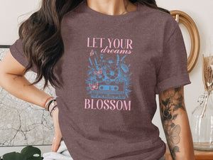 Brown t-shirt with "LET YOUR dreams BLOSSOM" text and cassette tape floral design.