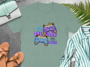 T-shirt with cartoon cats as game controllers and text "NEW LEVEL PLAY GAME".