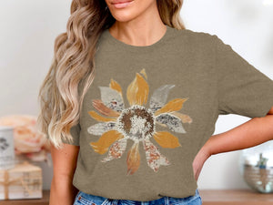 Brown t-shirt with a distressed sunflower graphic.