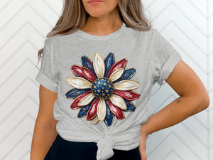 Grey t-shirt with a stylized sunflower graphic in red, white, and blue.