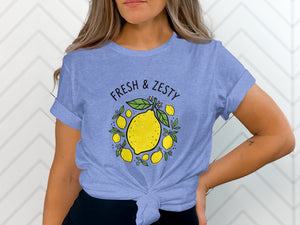 T-shirt with graphic of lemons and text "FRESH & ZESTY".