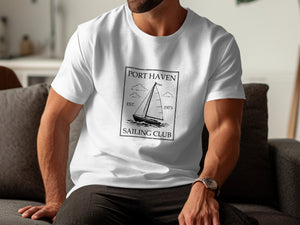 White t-shirt with "Port Haven Sailing Club Est. 1973" text and sailboat graphic.