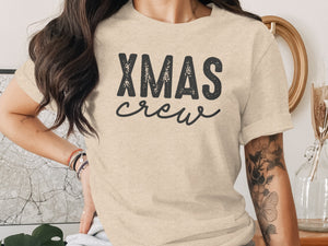 Beige t-shirt with black "XMAS crew" graphic print on the front.