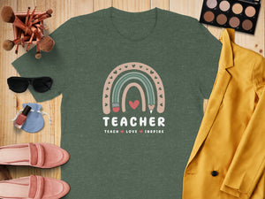 T-shirt with rainbow graphic and text "Teacher: Teach Love Inspire"