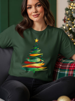 Dark green t-shirt with a watercolor Christmas tree graphic in colorful strokes.