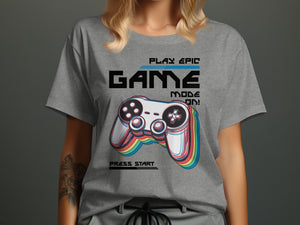 Grey t-shirt with glitch art video game controller and text "GAME MODE ON!".