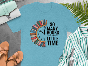 Light blue t-shirt with a clock graphic made of books and text "So Many Books So Little Time".