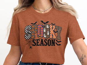 Orange t-shirt with "SPOOKY SEASON" text and Halloween graphics.
