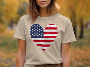 Tan t-shirt with distressed American flag heart graphic on chest