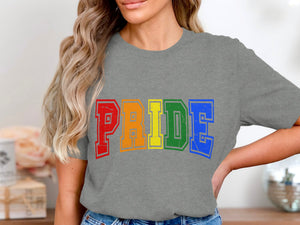 Grey t-shirt with rainbow "PRIDE" text in distressed block letters.