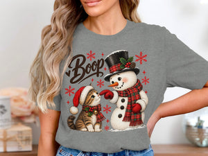 Christmas cat in Santa hat and snowman with text "Boop" and snowflakes.