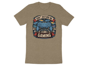 Brown t-shirt with a graphic of game controllers and text "Don't Disturb Me I'm Gaming".