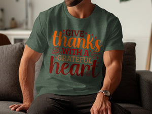 Green t-shirt with "Give thanks with a grateful heart" text and fall leaves.