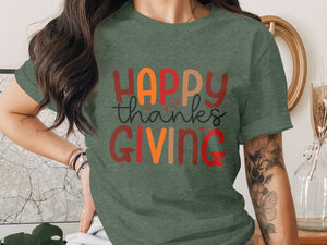 Green t-shirt with "Happy Thanksgiving" text in colorful letters.
