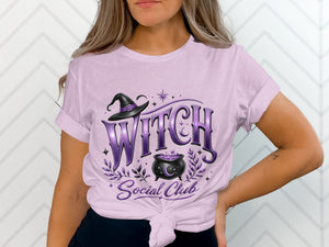 Witch Social Club graphic on a light purple t-shirt with witch hat and cauldron.