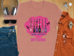 Crew neck t-shirt featuring a row of decorated witch brooms with text.