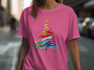 Pink t-shirt with a colorful, abstract Christmas tree graphic and yellow star.