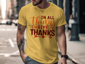 Yellow t-shirt with "IN ALL things GIVE THANKS" text and pumpkins.