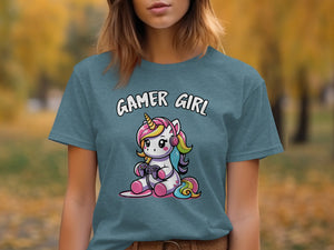 Teal t-shirt with cartoon gamer unicorn wearing headphones and holding a controller.