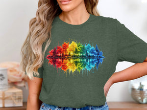 T-shirt with a watercolor forest reflected in a rainbow-colored lake.