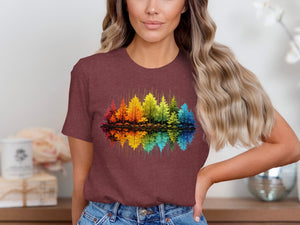 Maroon t-shirt with a colorful, abstract forest and reflection graphic.