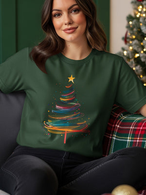 Green t-shirt with a colorful abstract Christmas tree graphic and a gold star.