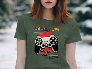 Green t-shirt featuring "LEVEL UP! NEVER QUIT" text and a video game controller.