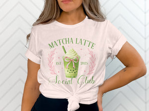 White t-shirt graphic: Matcha Latte Social Club with boba and pink bow.