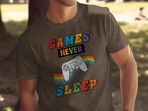 Brown t-shirt with "GAMES NEVER SLEEP" text and a rainbow-colored video game controller.