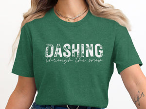 Green t-shirt with white text "DASHING through the snow"