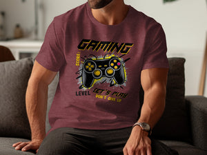 Maroon t-shirt with "GAMING" text, controller, and "LET'S PLAY DON'T GIVE UP" slogan.