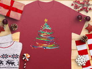 Maroon t-shirt with abstract, colorful Christmas tree graphic.