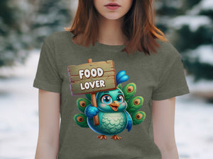 Cartoon peacock with "FOOD LOVER" sign on a t-shirt.