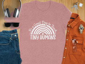 Pink t-shirt with white "It's a Good Day to Teach Tiny Humans" text and rainbow graphic.