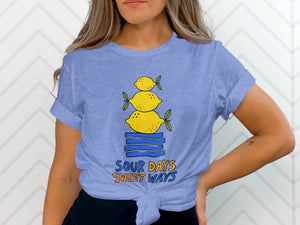 Light blue t-shirt with stacked lemons and text "SOUR DAYS SWEET WAYS".