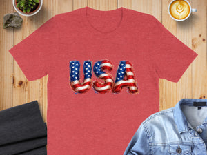 Red t-shirt with "USA" text in American flag design.